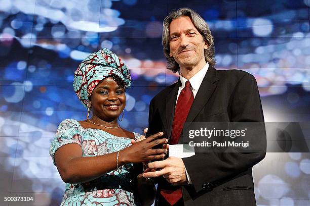 Chouchou Namegabe awards Honoree John Prendergast, Human Rights Activist; Founding Director, Enough Project, with the Vital Voices Solidarity Award...