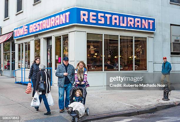 Fans in front of Tom’s Restaurant facade. The place is featured in the sitcom Jerry Seinfield. Currently, it is a famous tourist attraction in the...