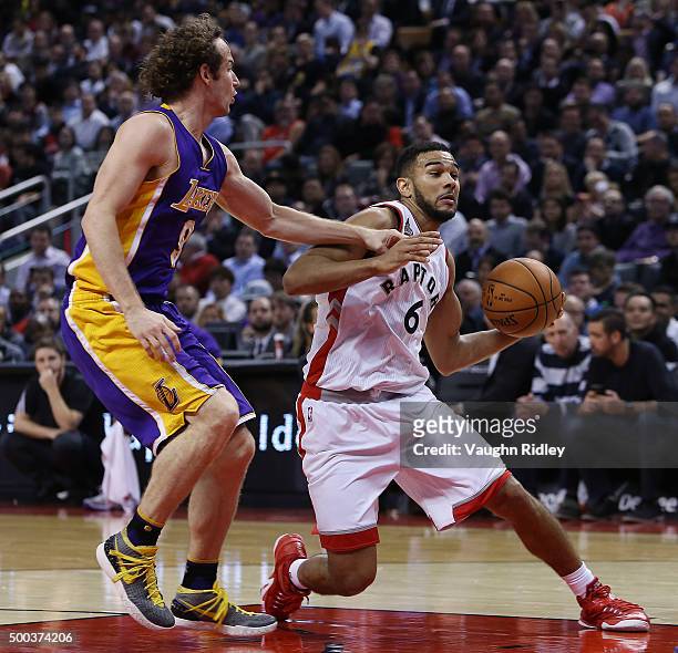 Cory Joseph of the Toronto Raptors battles with Marcelo Huertas of the Los Angeles Lakers during an NBA game at the Air Canada Centre on December 07,...