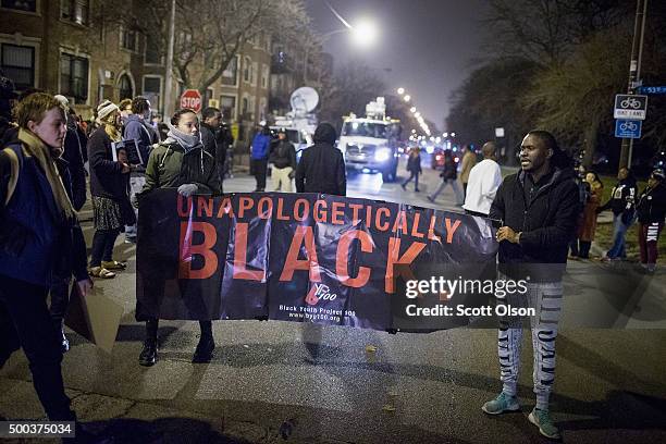 Demonstrators protesting the shooting death of Ronald Johnson rally in the Washington Park neighborhood on December 7, 2015 in Chicago, Illinois....