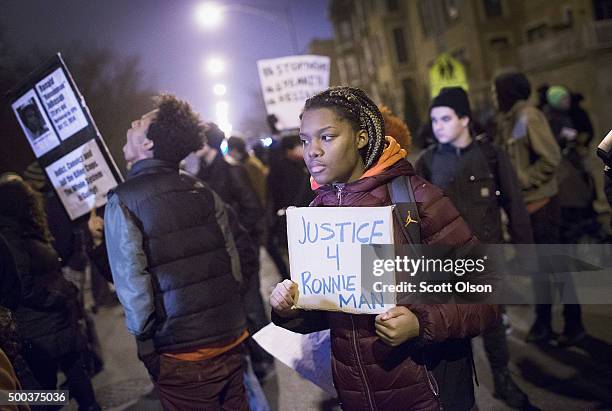 Demonstrators protesting the shooting death of Ronald Johnson rally in the Washington Park neighborhood on December 7, 2015 in Chicago, Illinois....
