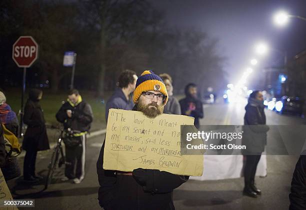 Demonstrators protesting the shooting death of Ronald Johnson rally in the Washington Park neighborhood on December 7, 2015 in Chicago, Illinois....