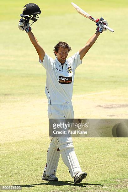 Ashton Agar of Western Australia celebrates after scoring his century during day three of the Sheffield Shield match between Western Australia and...