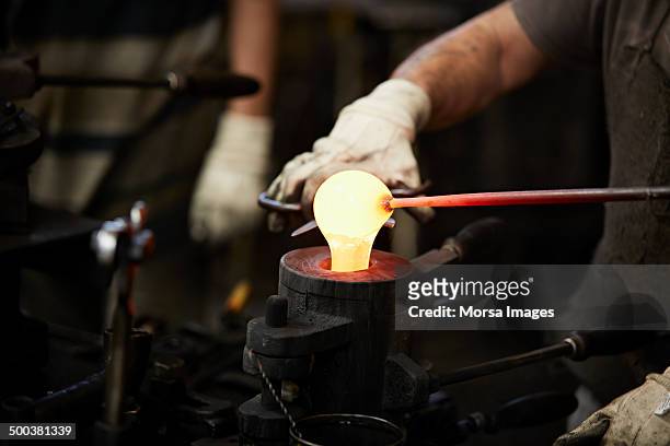 pouring of molten glass into mold - molten stock pictures, royalty-free photos & images