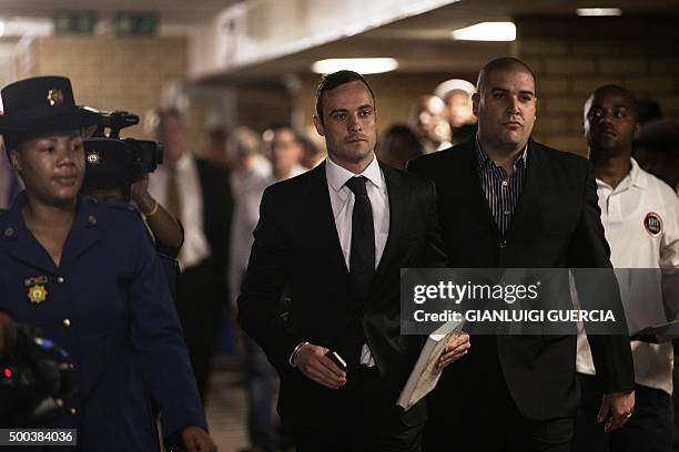 Former Paralympic champion Oscar Pistorius arrives for his hearing at the South African Gauteng Division High Court in Pretoria, South Africa, on...