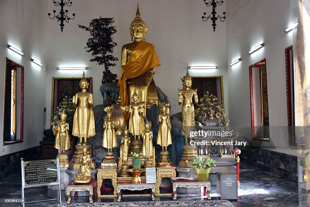 Golden buddha sit down at Wat Pho buddhist temple thailand