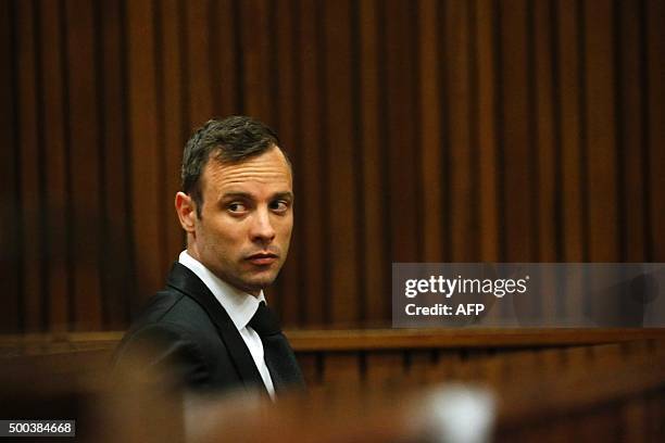 Former Paralympic champion Oscar Pistorius sits in the dock at the North Gauteng High Court in Pretoria, South Africa, ahead of his bail hearing,...