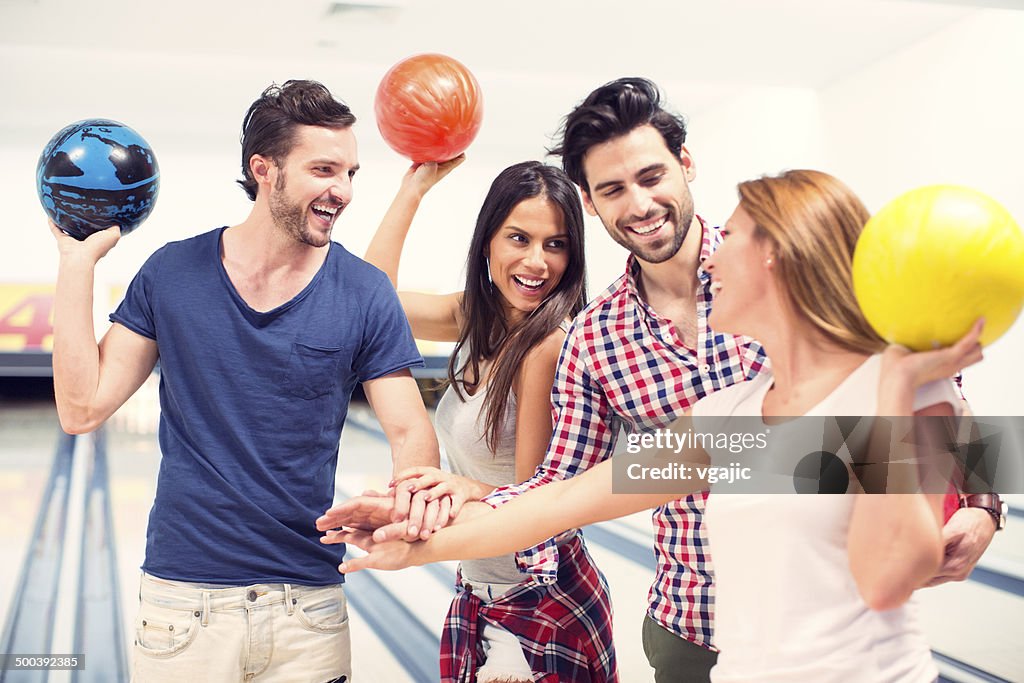 Cheerful Friends Bowling Together.