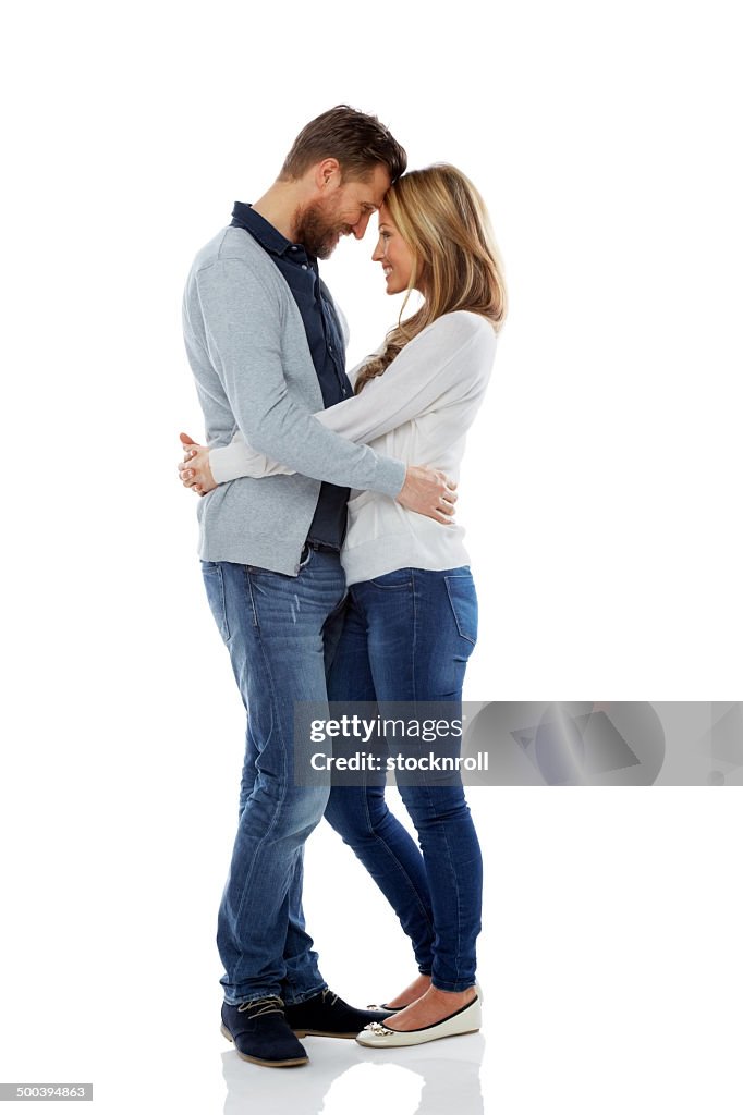 Loving couple embracing over white