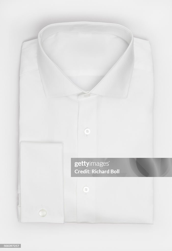 White folded shirt on a white background