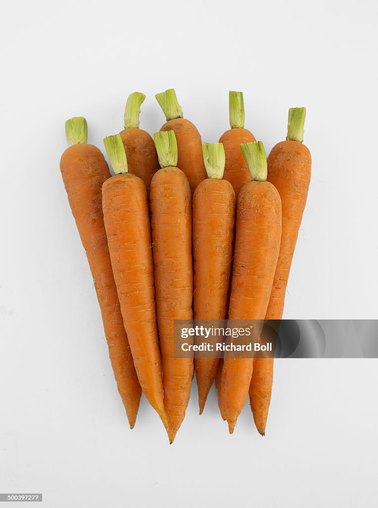 Trimmed carrots on a white background