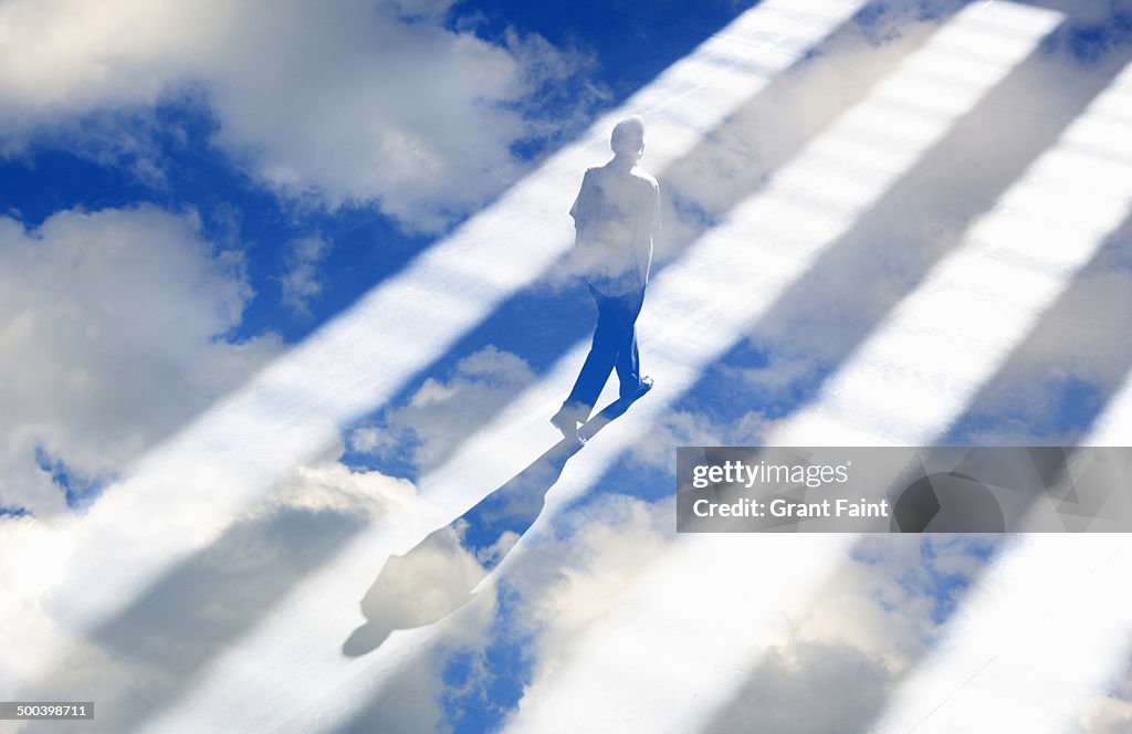 Man walking in light rays