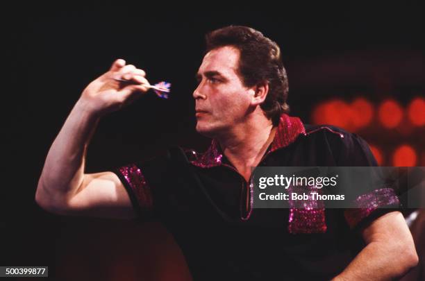 English darts player Bobby George competing in the Embassy BDO World Darts Championship at the Lakeside Country Club in Frimley Green, Surrey, 18th...