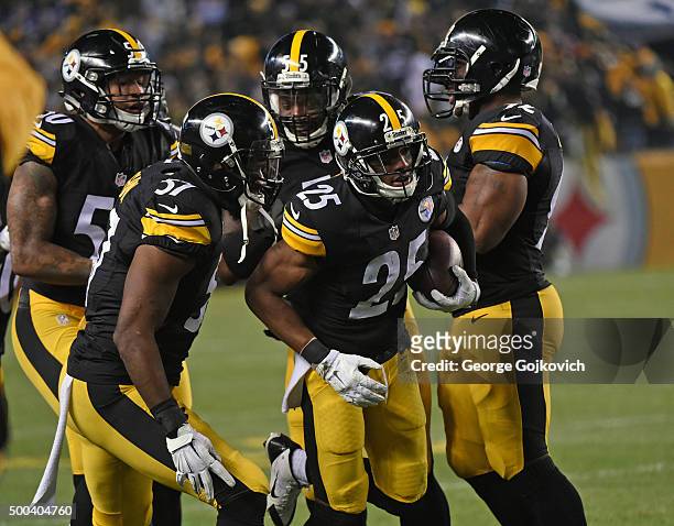 Cornerback Brandon Boykin of the Pittsburgh Steelers is congratulated by linebackers Terence Garvin, Ryan Shazier, Arthur Moats and James Harrison...