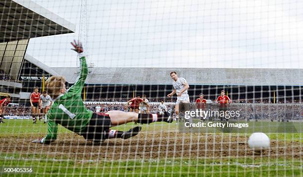 Spurs striker Clive Allen tucks his penalty past Manchester United goalkeeper Gary Walsh during the First Division match between Tottenham Hotspur...