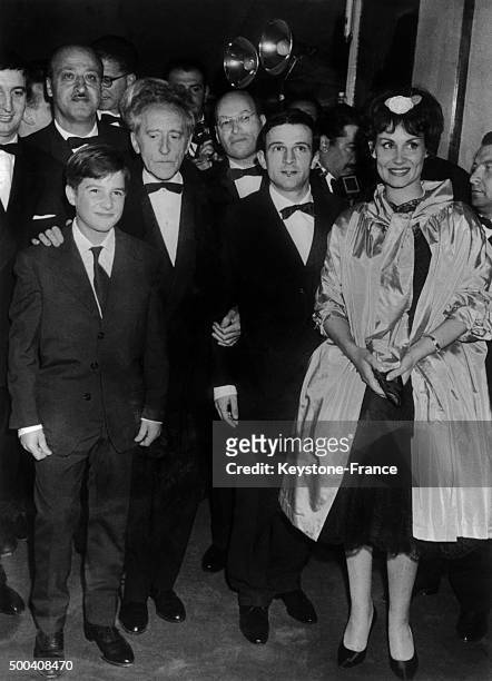 French actor Jean-Pierre Leaud, French writer-poet Jean Cocteau, French film director Francois Truffaut and Claire Maurier together during the Cannes...