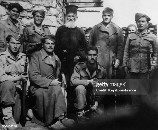 An Orthodox priest with partisans fighting to liberate Greece in 1939 from German occupation during the second world war, 1939 in Greece.