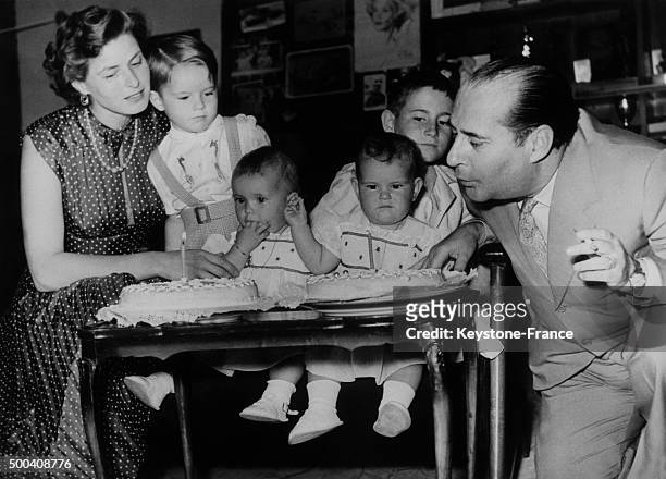 Ingrid Bergman and Roberto Rossellini celebrate the first birthday of their twin daughters, Isabella and Isotta, with their son Robertino and...