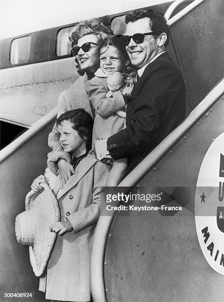The American actress Rita Hayworth arriving at New York's airport with her latest husband, the artist Dick Haymes, and her two daughters, Rebecca...