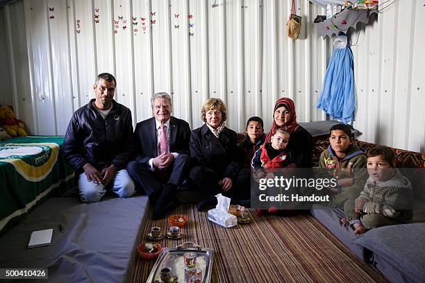 In this handout photo provided by the German Government Press Office German President Joachim Gauck and his partner, Daniela Schadt speak with a...
