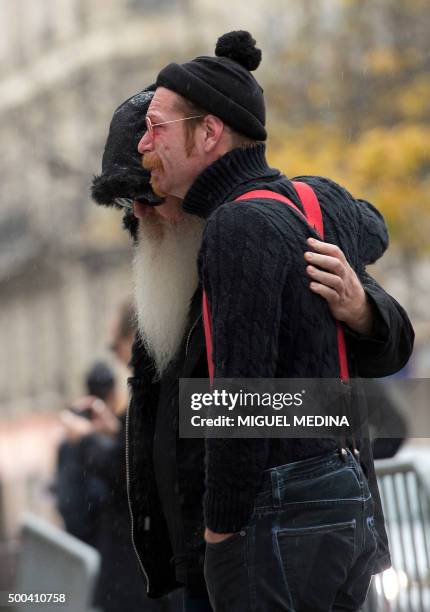 Singer of the US rock group Eagles of Death metal Jesse Hughes and guitarist Dave Catching pay tribute to the victims of the November 13 Paris...