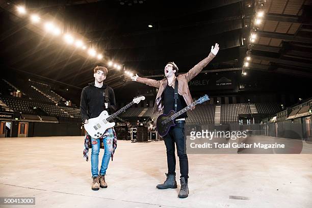 Portrait of American musicians Alex Gaskarth and Jack Barakat, guitarists with pop punk group All Time Low, photographed before a live performance at...