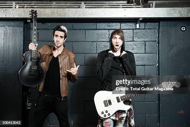 Portrait of American musicians Alex Gaskarth and Jack Barakat, guitarists with pop punk group All Time Low, photographed before a live performance at...