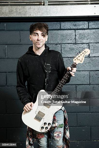 Portrait of American musician Alex Gaskarth, guitarist and vocalist with pop punk group All Time Low, photographed before a live performance at...