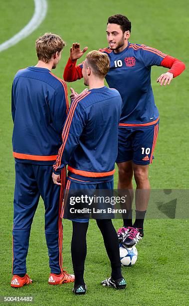 Hakan Calhanoglu jokes with Stefan Kiessling during a Bayer Leverkusen training session on the eve of the UEFA Champions League groupe E match...