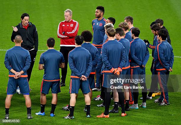 Head coach Roger Schmidt gives instructions to his players during a Bayer Leverkusen training session on the eve of the UEFA Champions League groupe...