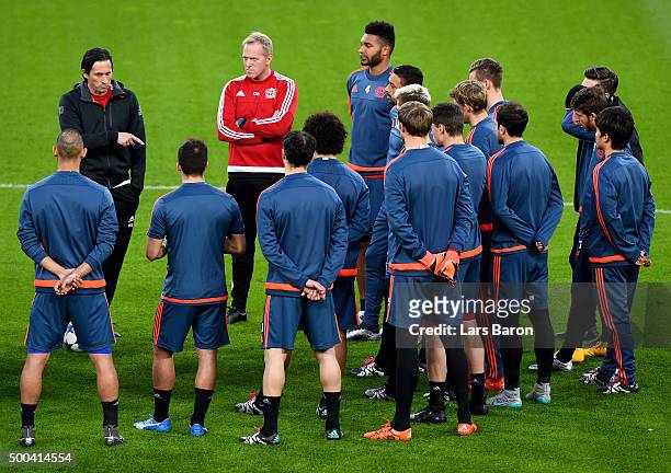 Head coach Roger Schmidt gives instructions to his players during a Bayer Leverkusen training session on the eve of the UEFA Champions League groupe...