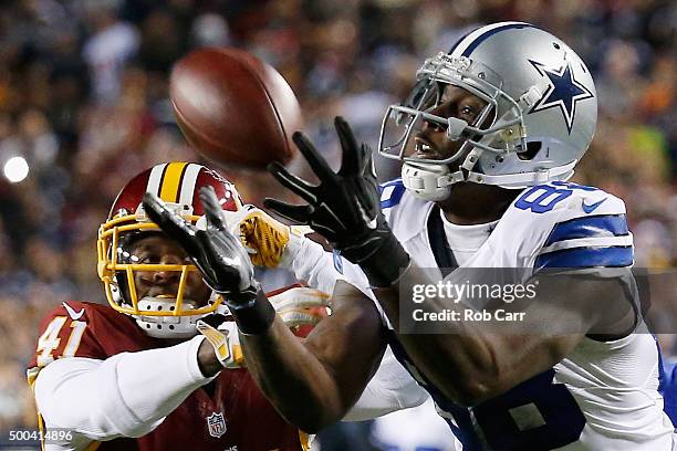 Wide receiver Dez Bryant of the Dallas Cowboys catches a pass against cornerback Will Blackmon of the Washington Redskins late in the fourth quarter...