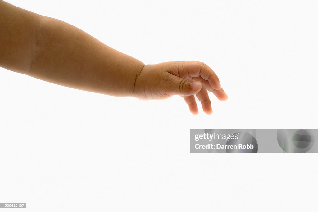 Baby girl's with outstretched hand