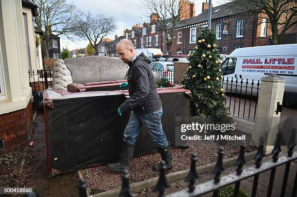 Residents in Warwick road start to empty their possessions from their homes after Storm Desmond caused flooding on December 8, 2015 in Carlisle,...