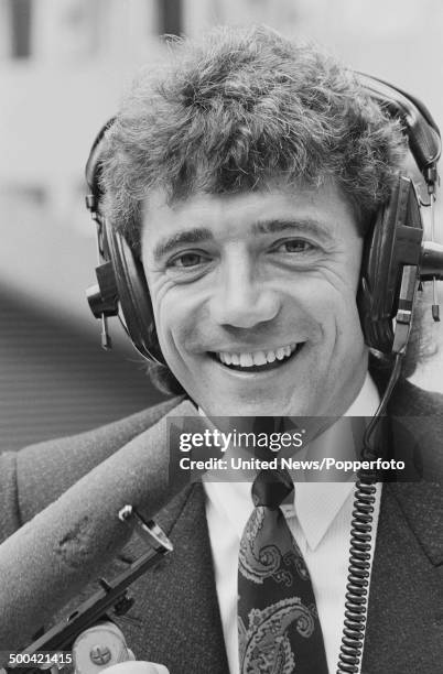 English footballer, manager and broadcaster Kevin Keegan posed wearing commentator's headset on 15th October 1985.