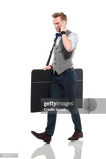 young architect talking on cell phone - waistcoat isolated stock pictures, royalty-free photos & images