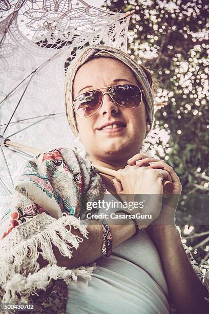 portrait of a young woman with lace umbrella outdoors - lace parasol stock pictures, royalty-free photos & images