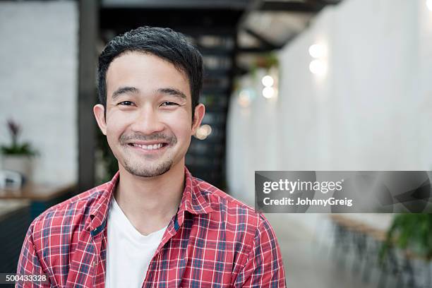 casual young asian businessman smiling towards camera, portrait - asian man potrait stock pictures, royalty-free photos & images