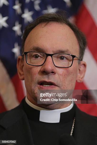 Rev. Richard Graham, bishop of the Metropolitan D.C. Synod, Evangelical Lutheran Church in America, speaks during a news conference with senators and...