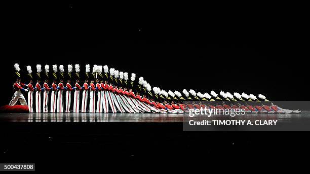 The Rockettes tumble down in the "Parade of the Wooden Soldiers" during the 2015 Radio City Christmas Spectacular at Radio City Music Hall December...