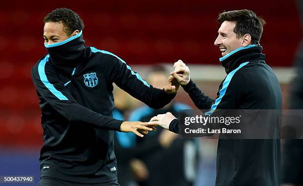 Neymar jokes with Lionel Messi during a FC Barcelona training session on the eve of the UEFA Champions League groupe E match against Bayer Leverkusen...