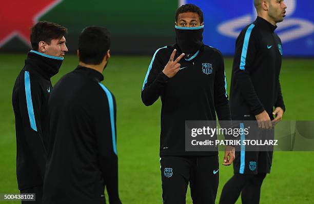 Barcelona´s Argentinian striker Lionel Messi , Brazilian striker Neymar and Uruguain striker Luis Suarez take part at a training session on the eve...