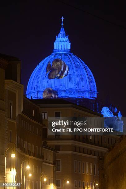 Picture is projected on the cupola of St. Peters Basilica during the show Fiat Lux : Illuminating Our Common Home, on December 8, 2015 at the...