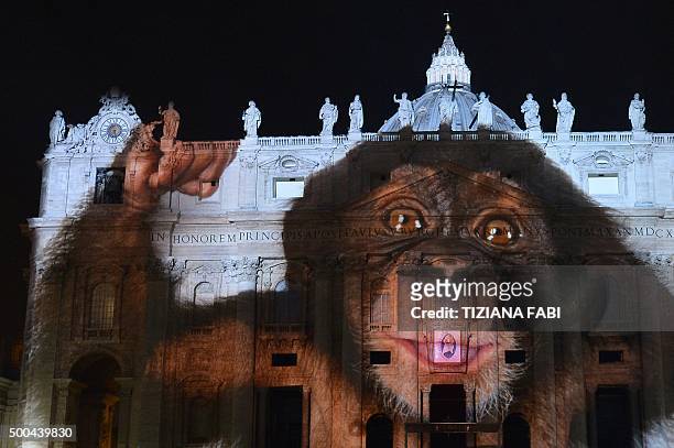 Picture is projected on the cupola of St. Peters Basilica during the show Fiat Lux : Illuminating Our Common Home, on December 8, 2015 at the...
