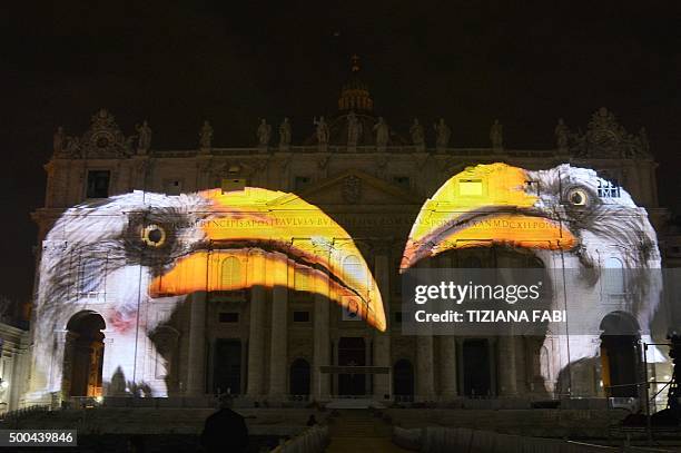 Picture is projected on the cupola of St. Peters Basilica during the show Fiat Lux : Illuminating Our Common Home, on December 8, 2015 at the...