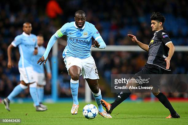 Yaya Toure of Manchester City makes a break past Mahmoud Dahoud of Borussia Moenchengladbach during the UEFA Champions League Group D match between...