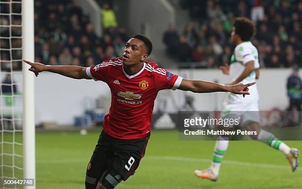 Anthony Martial of Manchester United celebrates scoring their first goal during the UEFA Champions League match between VfL Wolfsburg and Manchester...