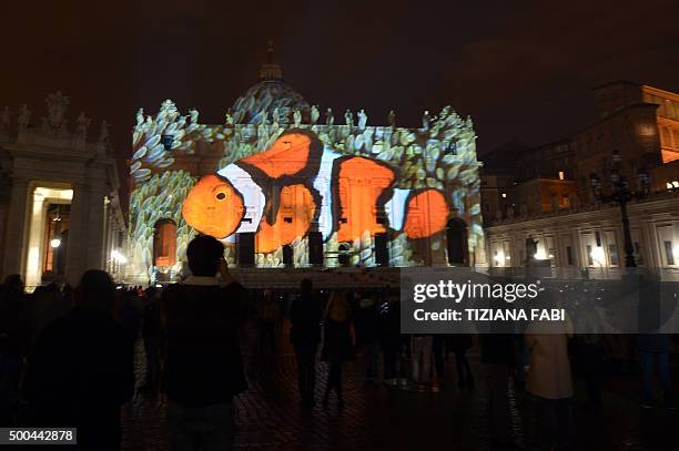 Picture is projected on St. Peters Basilica during the show Fiat Lux : Illuminating Our Common Home, on December 8, 2015 at the Vatican. Images by...