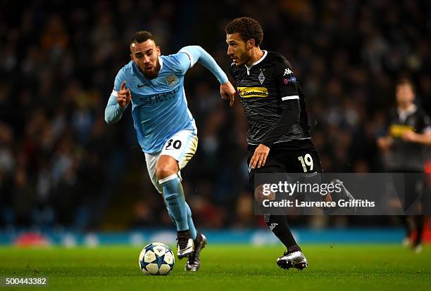 Fabian Johnson of Borussia Moenchengladbach battles for the ball with Nicolas Otamendi of Manchester City during the UEFA Champions League Group D...