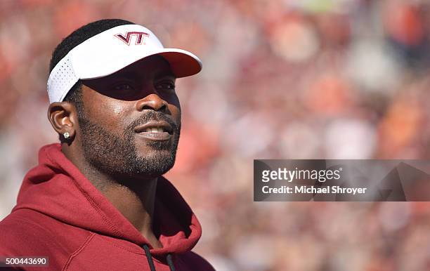 Virginia Tech Hokies former quarterback Mike Vick looks on from the sidelines during the game against the North Carolina Tar Heels at Lane Stadium on...